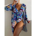 Women's floral print bikini three-piece swimsuit set in green, shown with a matching coat.