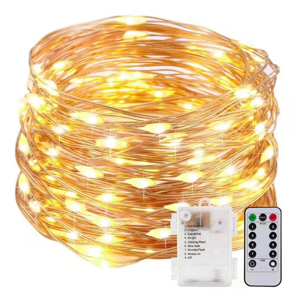 12-metre copper wire LED string lights with 120 bulbs arranged in garden setting