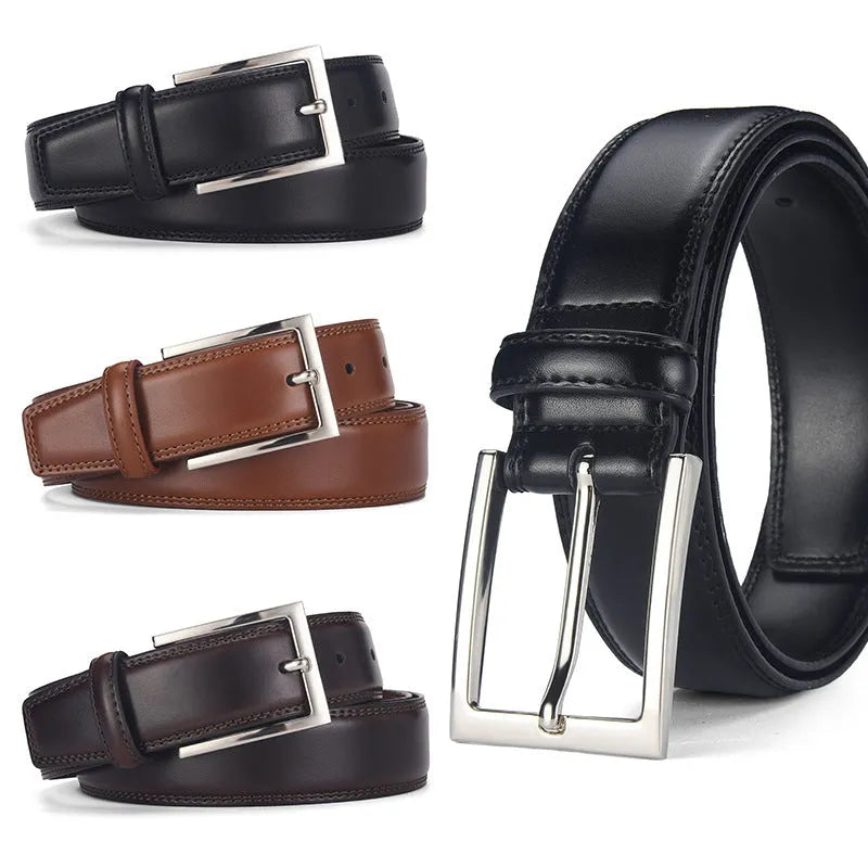 Men's black leather belt with a silver alloy pin buckle on a wooden background.