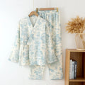 Women's pink pure cotton gauze long sleeve lounge suit with matching trousers on a hanger.