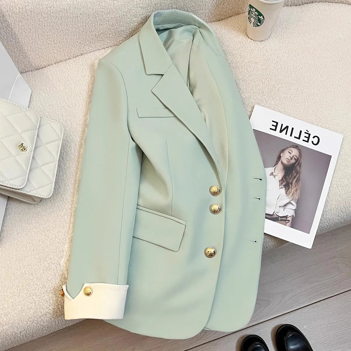 Women's loose-fit polyester commuting coat in milky white, showing long sleeves and pockets.
