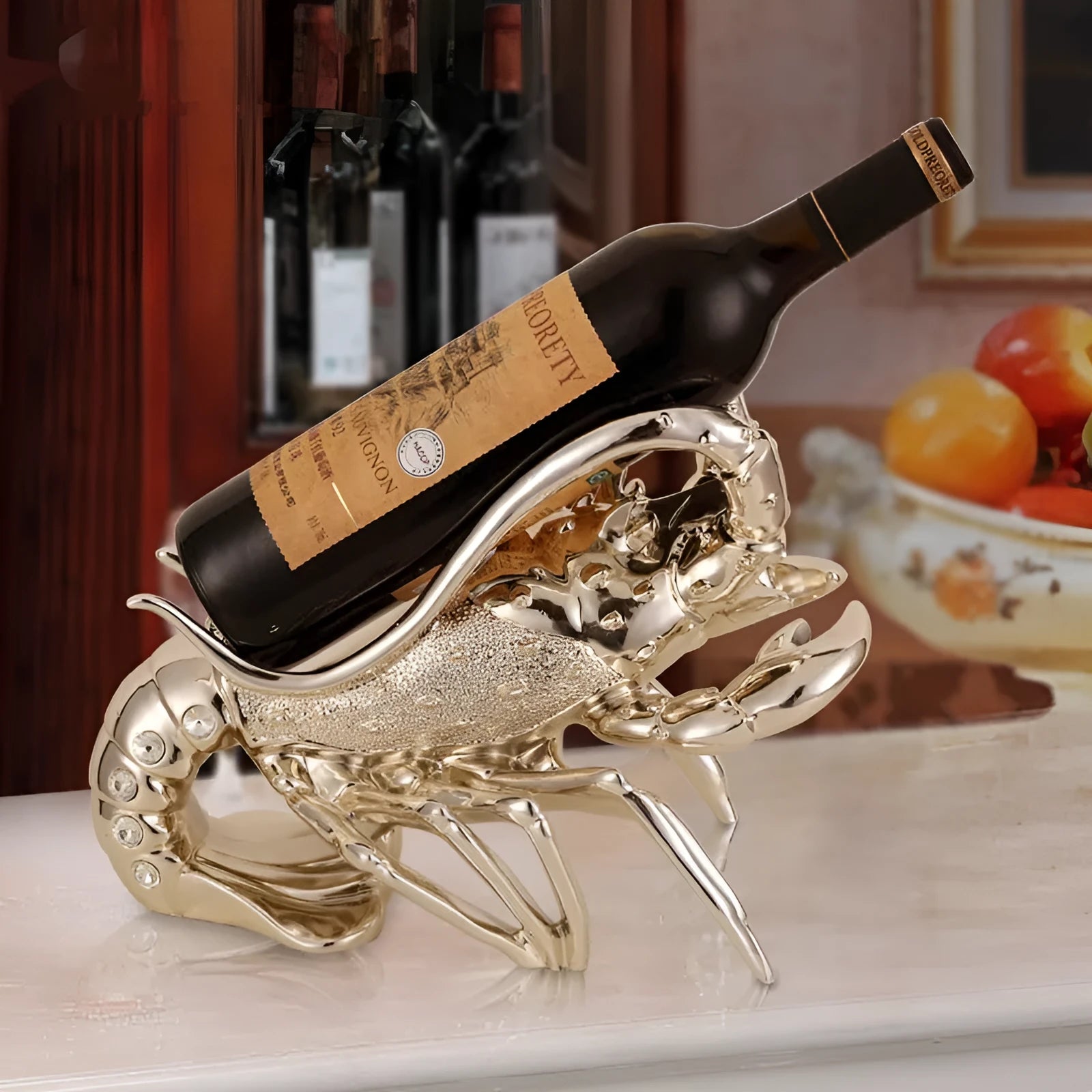 Lobster wine rack ornament in rose gold or silver metallic finish holding bottle