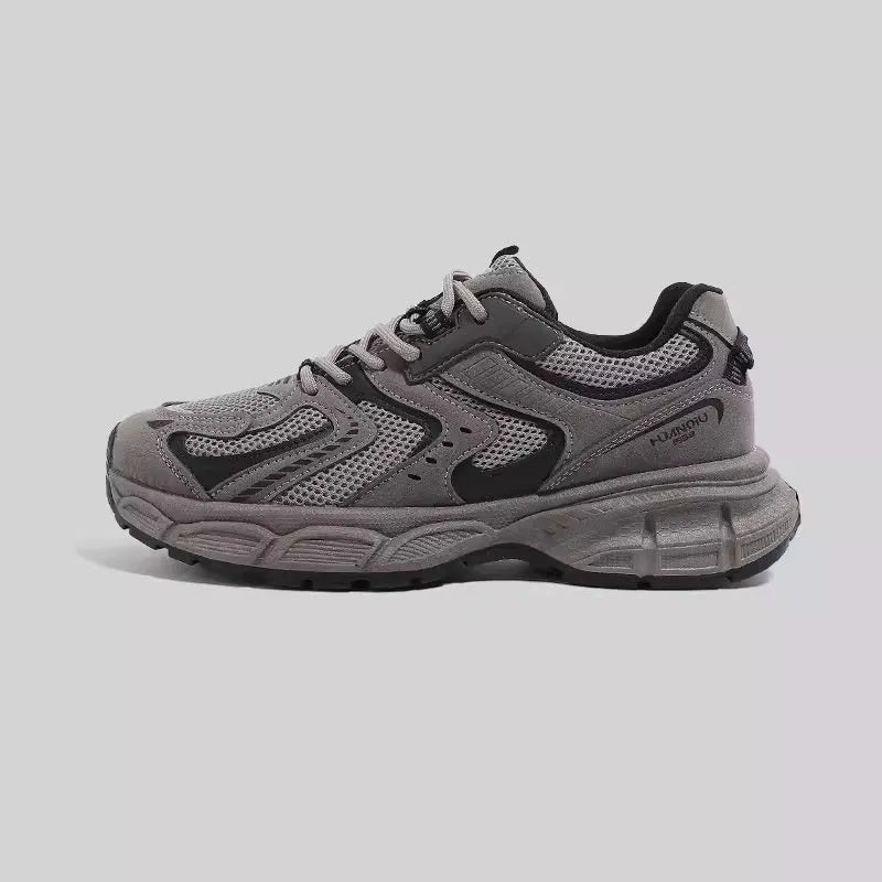 Low-top casual platform sneaker in grey with a round toe, leather stitching, and a flat 3-5cm heel.