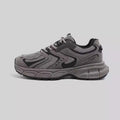 Low-top casual platform sneaker in grey with a round toe, leather stitching, and a flat 3-5cm heel.