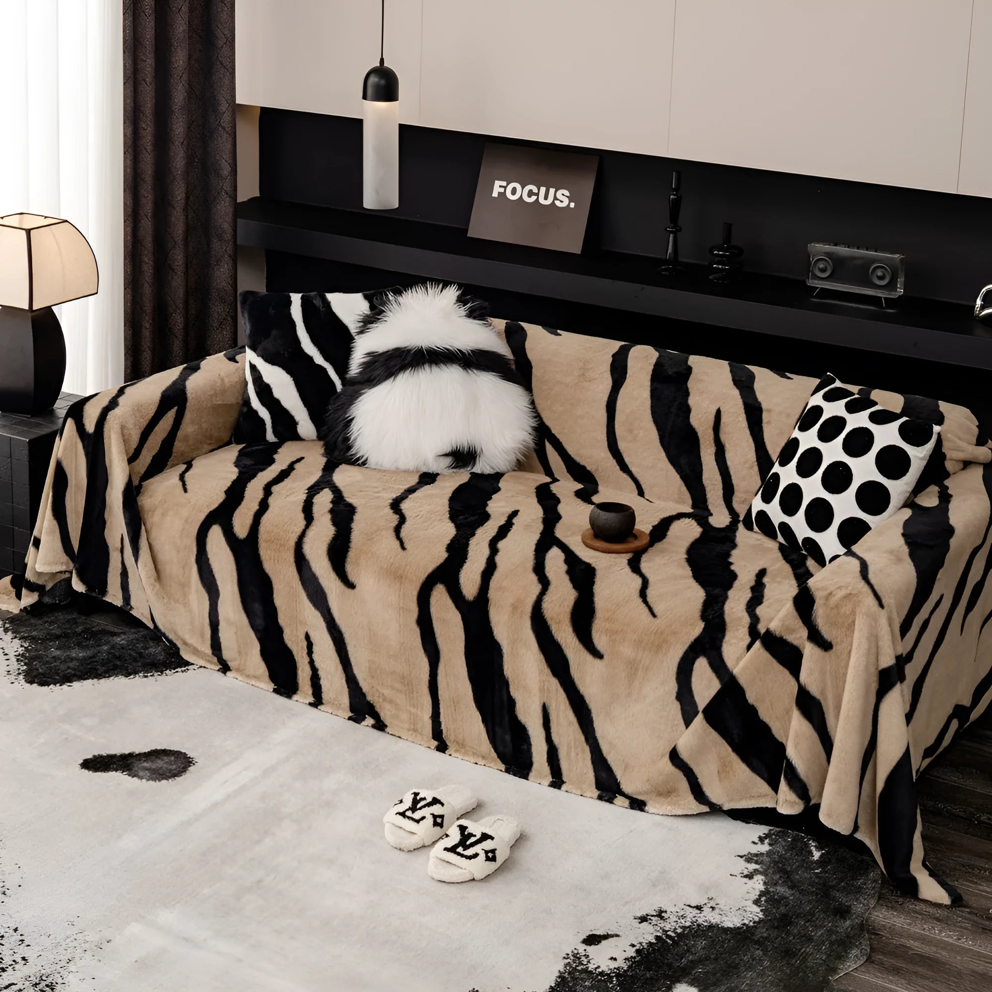 Zebra pattern flannel sofa cover and pillowcase set on a sofa, shown in caramel colour.