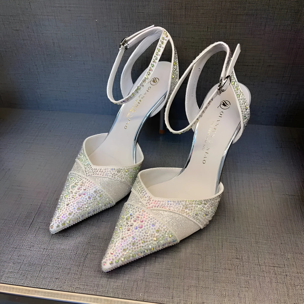 Women's black hollow high heels with red sole and pointed toe stiletto design