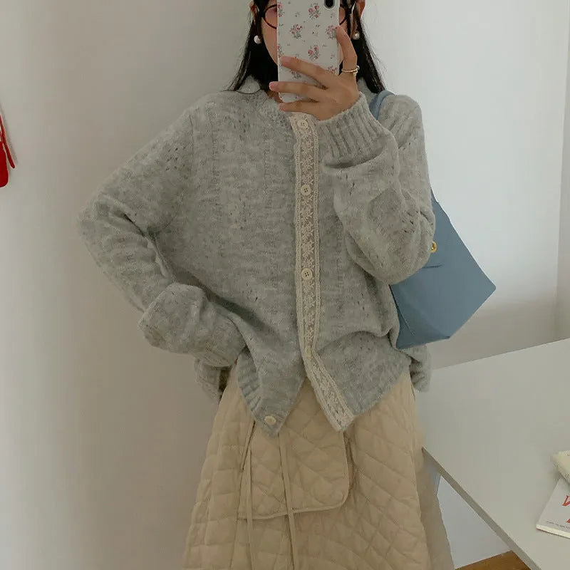 Loose-fit retro style cardigan coat in viscose knit, shown in apricot colour.
