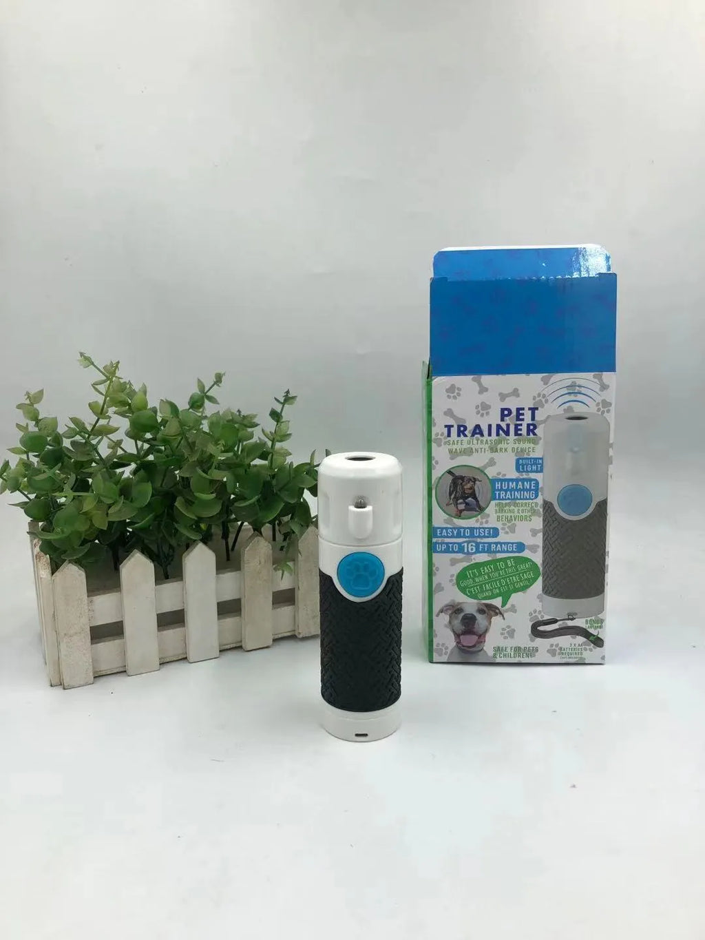 White handheld ultrasonic dog bark stop trainer device with ABS plastic construction