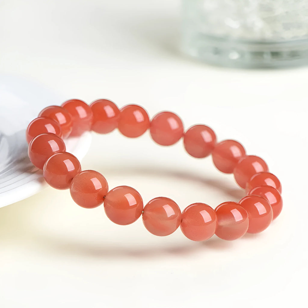 Natural South Red Cherry Agate scattered bead bracelet showing cherry red colour and polished surface