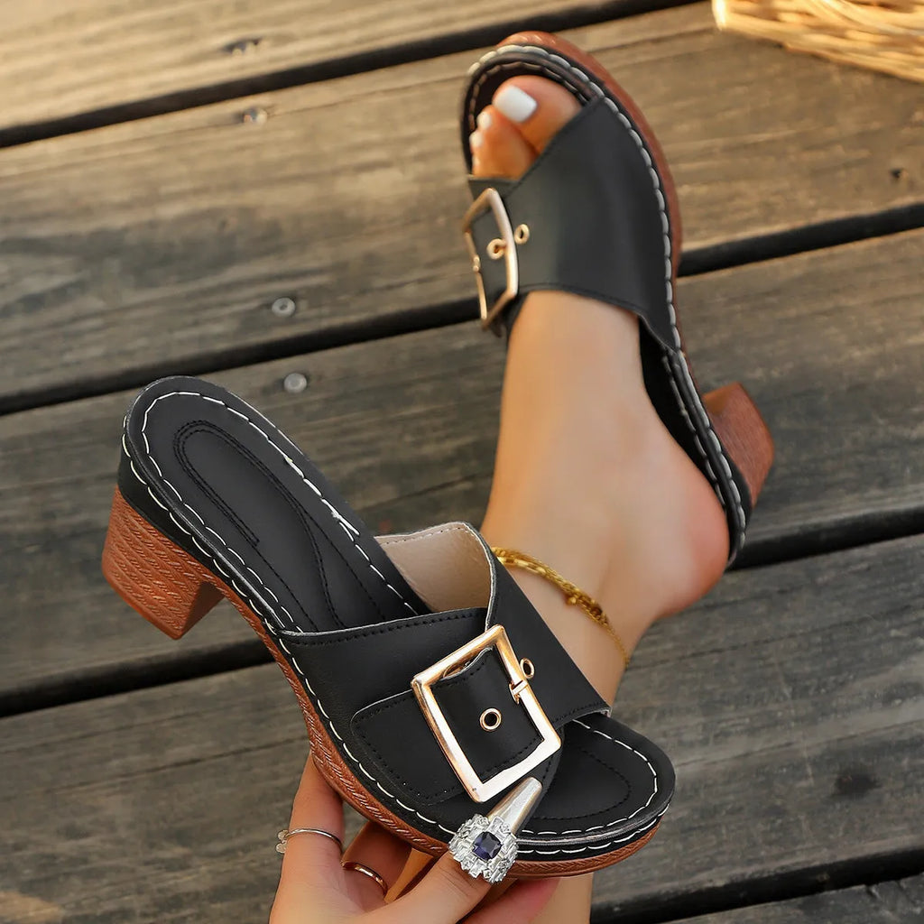 Women's black summer slippers with chunky heel and silver metal buckle on round toe design