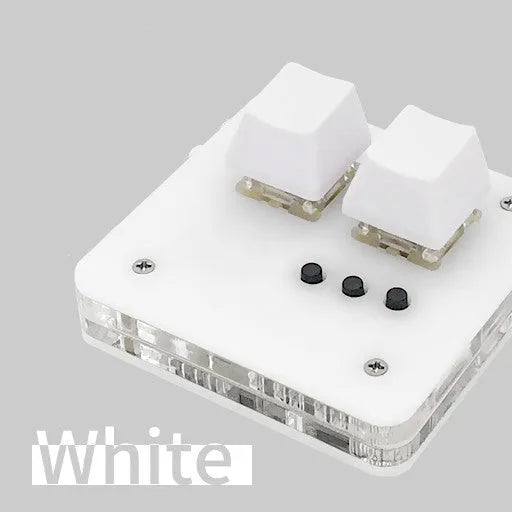 Compact white mini USB keyboard with multimedia keys on a desk.