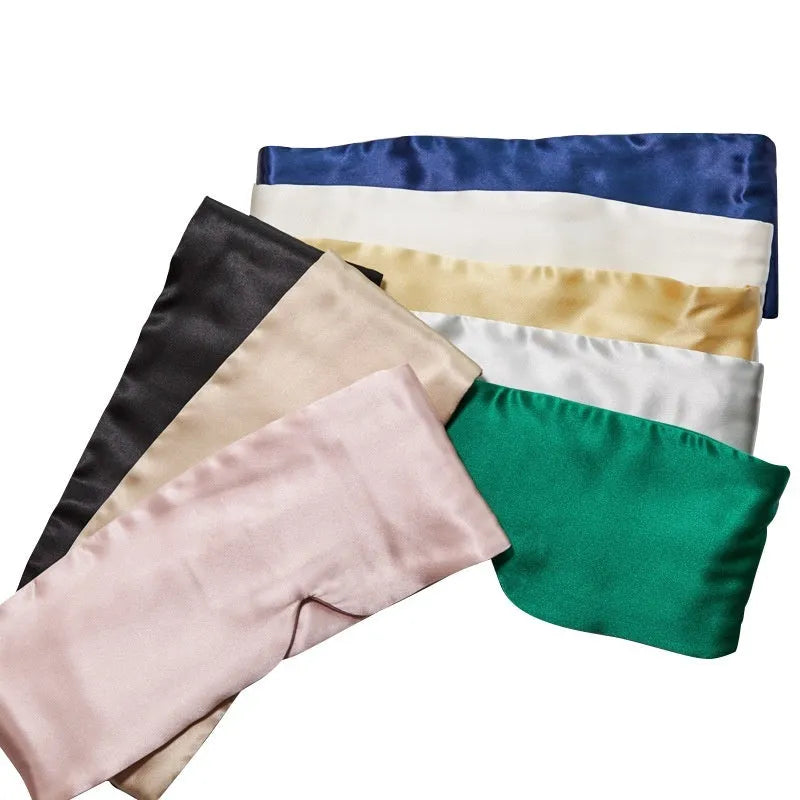 Silk sleep eye mask in multiple colours including champagne gold and navy blue.