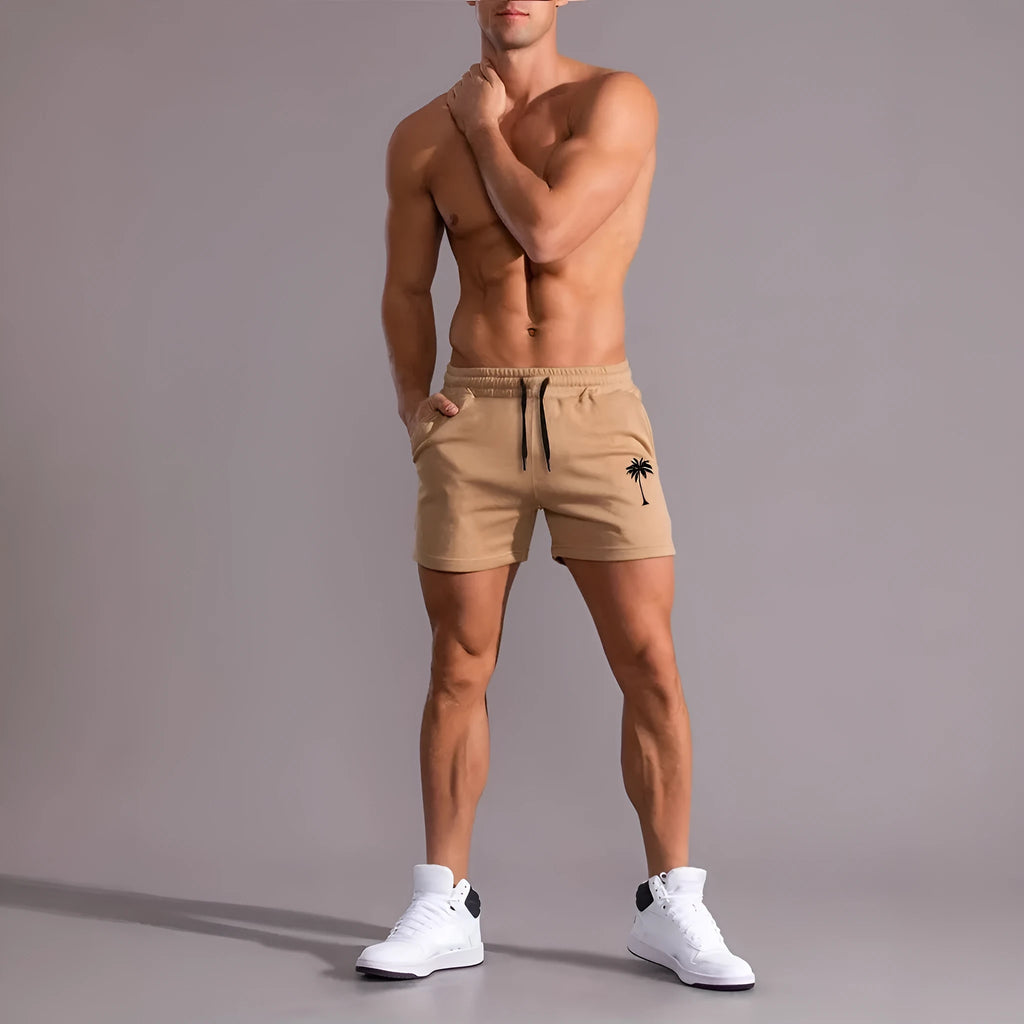 Men's khaki sports shorts with coconut leaf print pattern and straight leg design