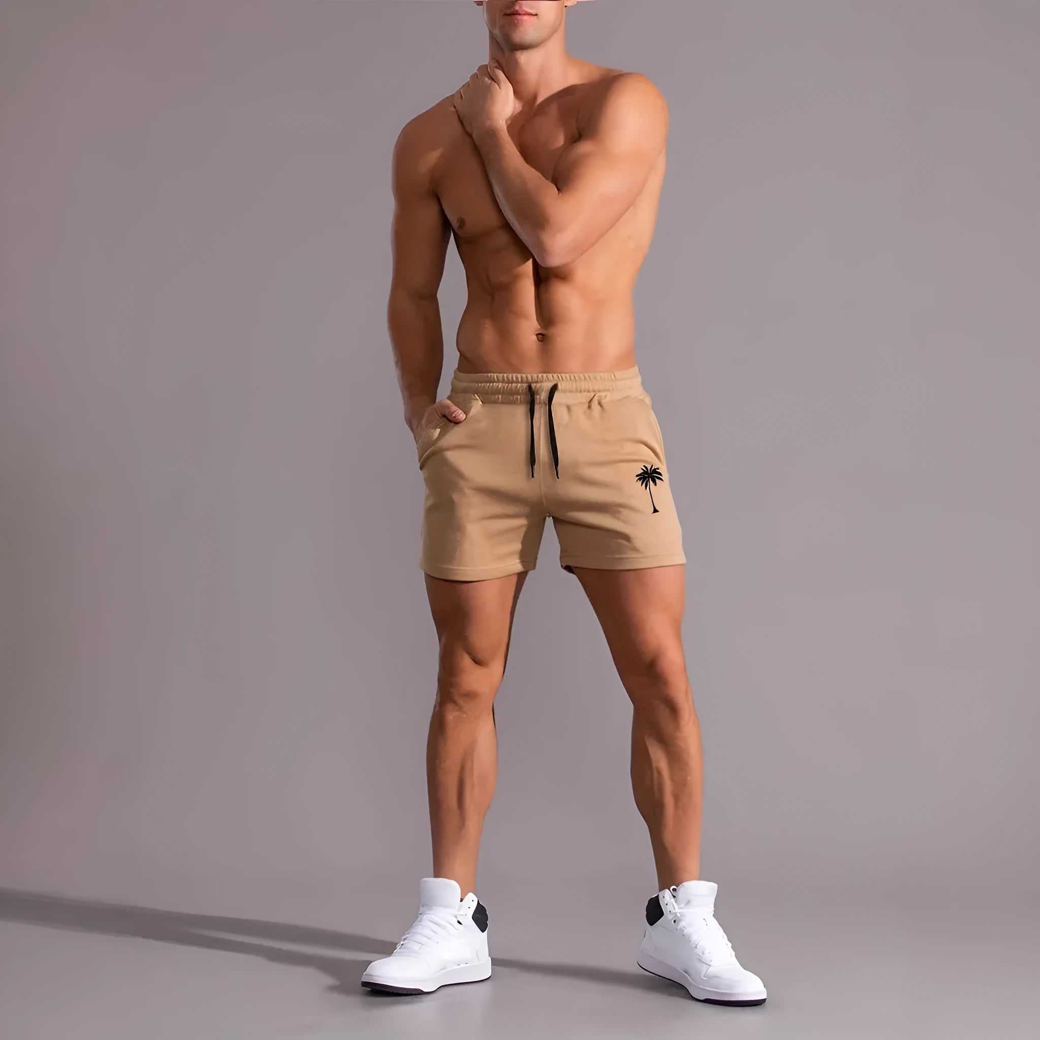 Men's khaki sports shorts with coconut leaf print pattern and straight leg design