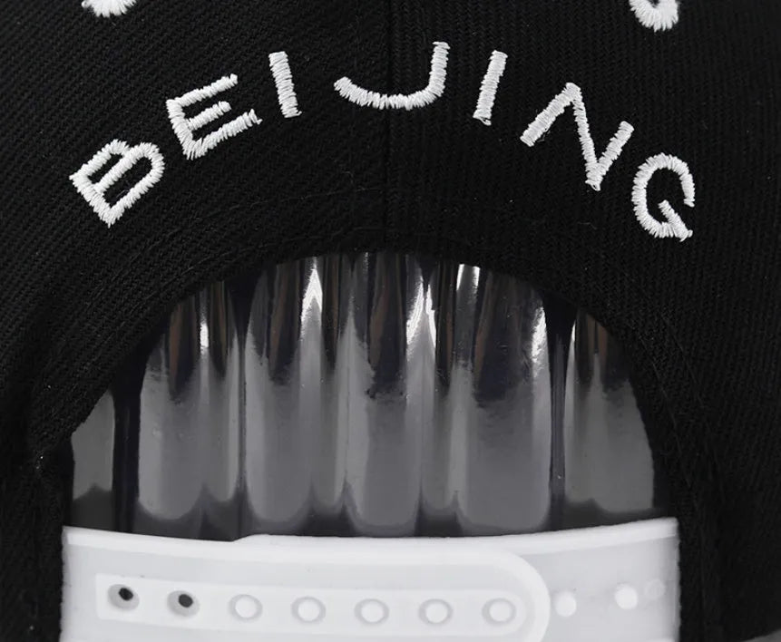 Adjustable cotton baseball cap in dome crown style, available in black and white colours