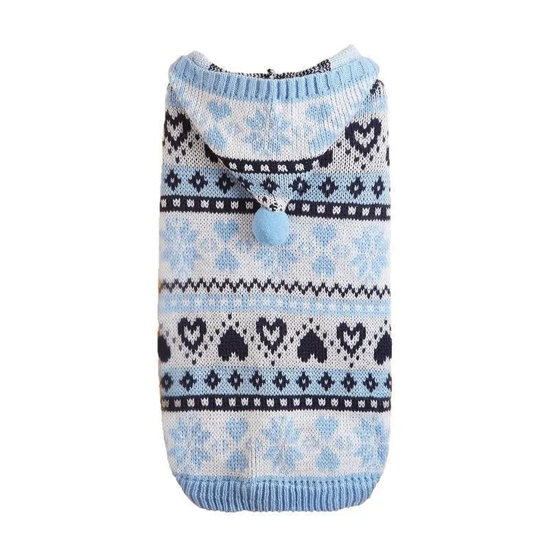 Pink knitted dog sweater with snowflake, love heart and stripe camouflage pattern on a small dog.