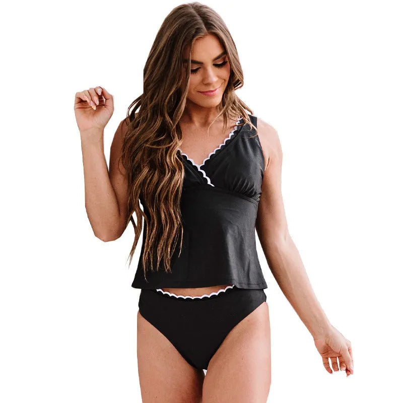 Black women's one-piece split swimsuit made of nylon, shown sleeveless.