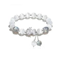 Natural black agate wave-shaped couple bracelet with money painting design on gray background