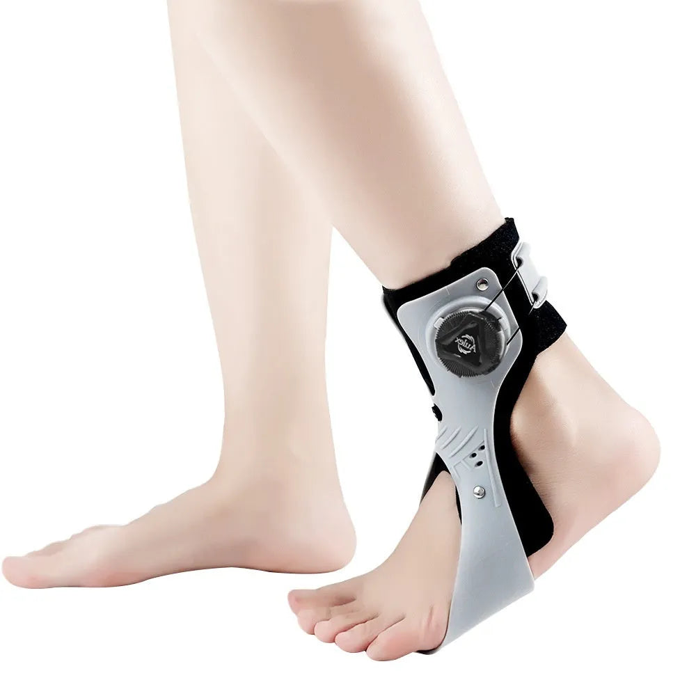 Grey and black ankle fixation brace with an airbag button, shown in separate left and right versions.