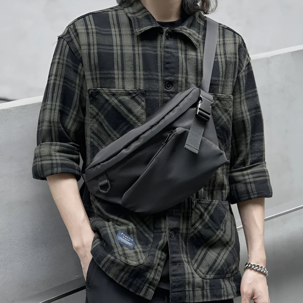 Black men's slanted chest bag with Oxford fabric construction and sewing line detailing