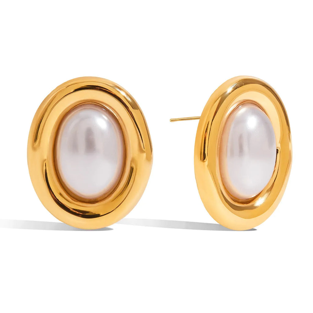 A pair of stainless steel vintage pearl stud earrings with an electroplated silver-coloured finish.