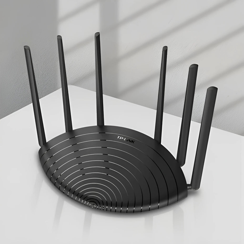 TP-Link TL-WDR7661 AC1900 wireless gigabit router on a desk, showing Ethernet ports and compact size.