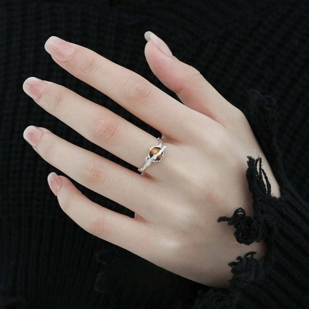 Women's Saturn open ring with adjustable size and electroplated white gold finish