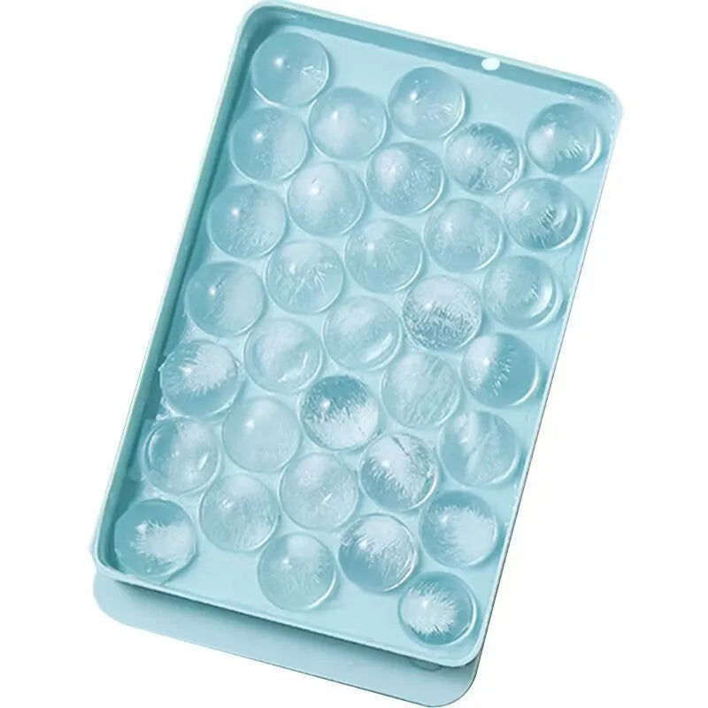 Blue round ice cube tray with 33 moulds and transparent lid