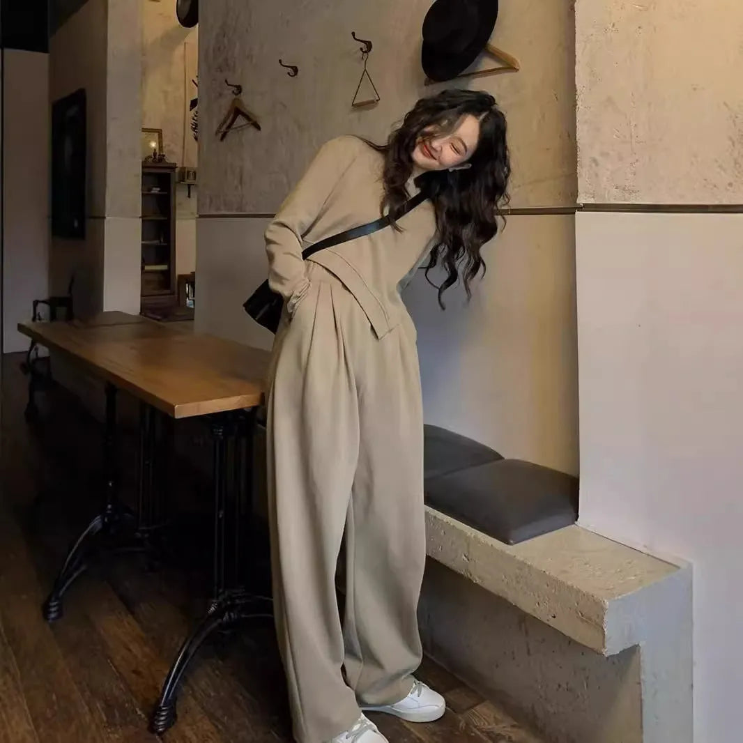 Brown women's loose fit casual sports suit set with long sleeve top and trousers on a model.