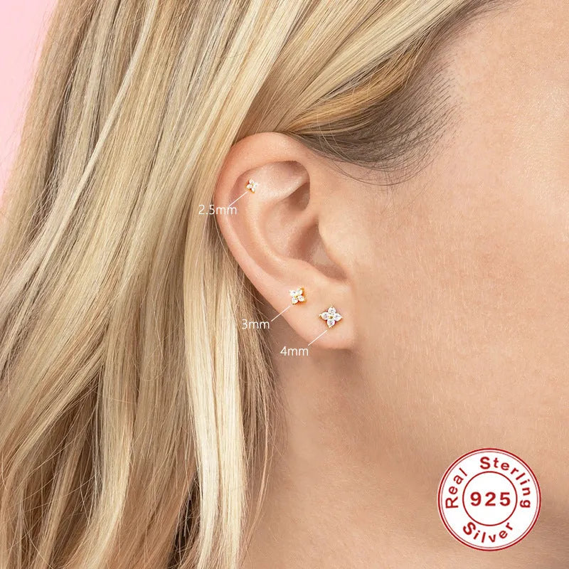 S925 sterling silver stud earrings with geometric petal crystal flower design in gold or platinum finish.