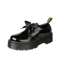 Women's black leather shoes with thick sole, cross strap, and ribbon lacing closure