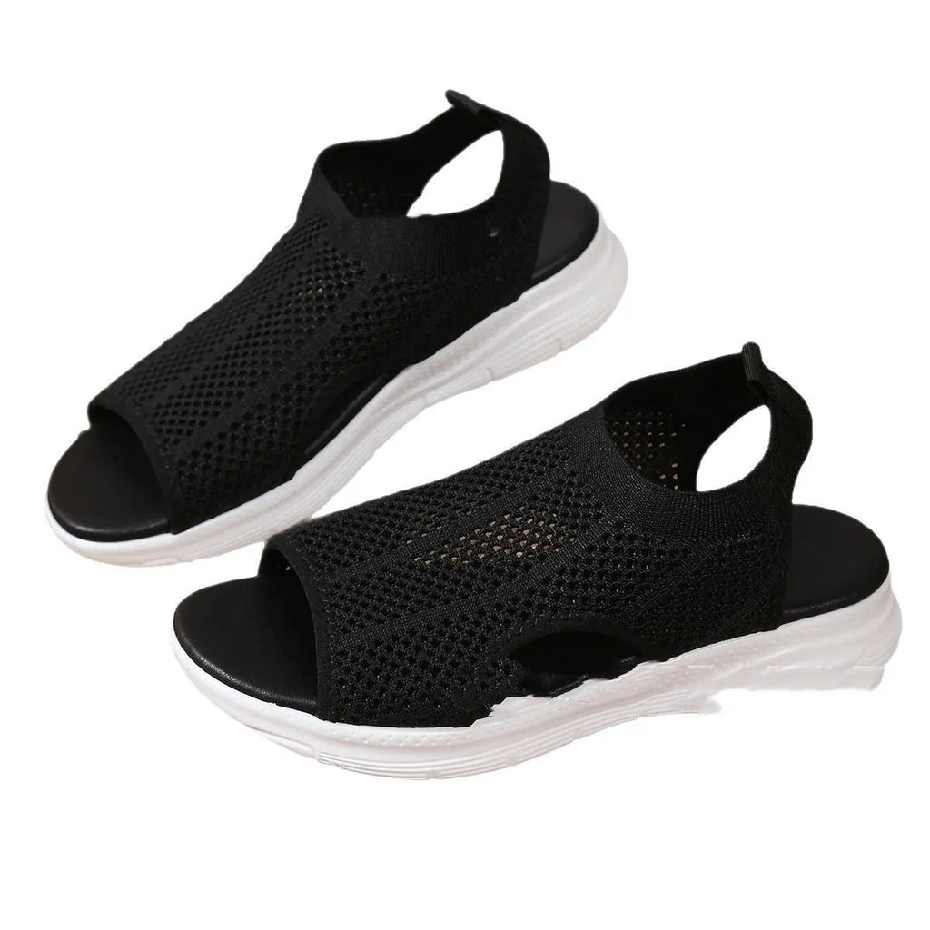 Women's platform sports sandals in black, milky white, and pink on a flat head design with a rubber sole.