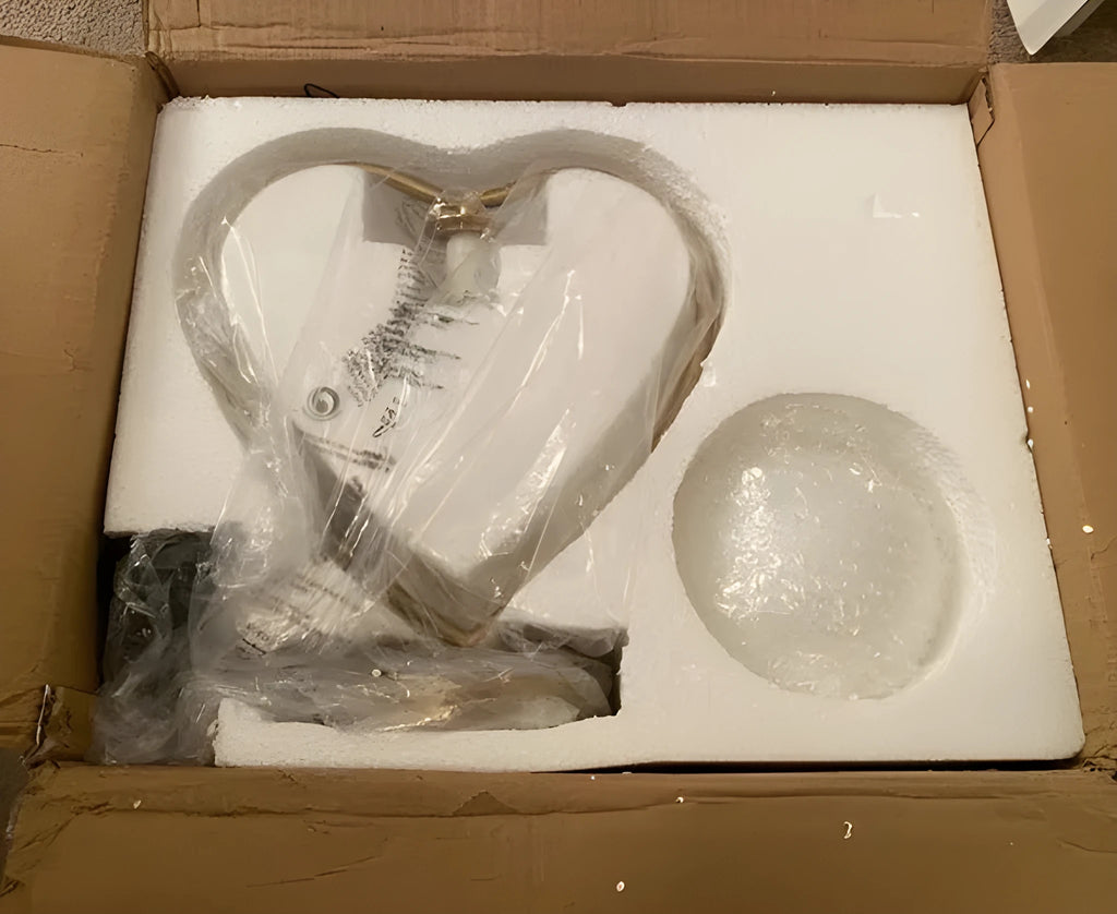 Heart shaped white LED bedside lamp with touch dimmer controls on a wooden table.