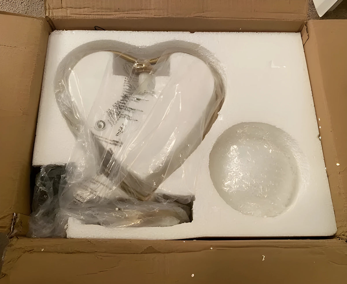 Heart shaped white LED bedside lamp with touch dimmer controls on a wooden table.
