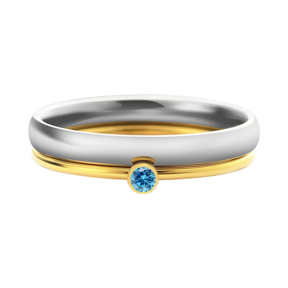 Geometric engraved titanium steel ring with December birthstone colour and gold tone electroplated handle.