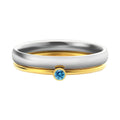Geometric engraved titanium steel ring with December birthstone colour and gold tone electroplated handle.