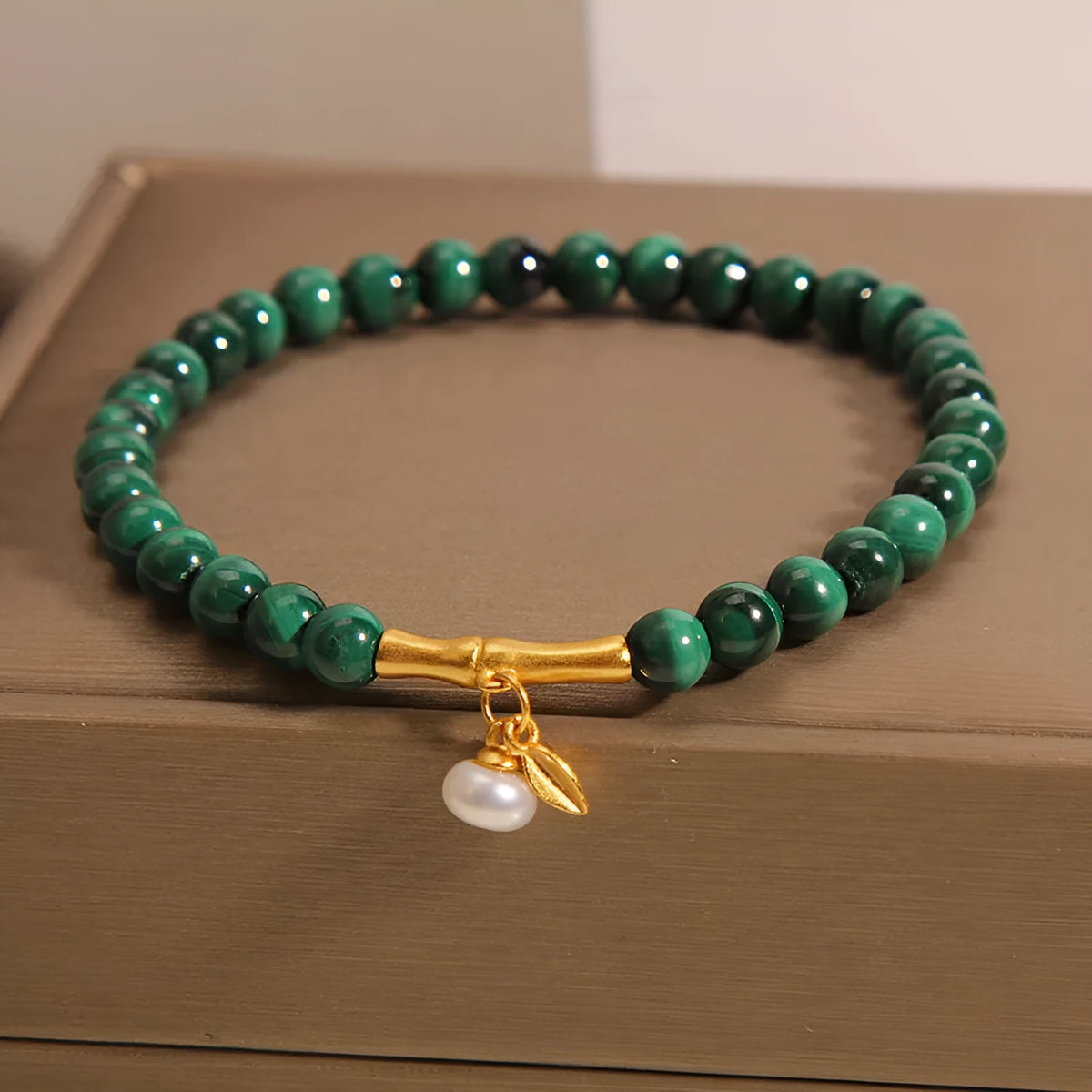 Women's adjustable bamboo bracelet with white crystal elements on a wrist.