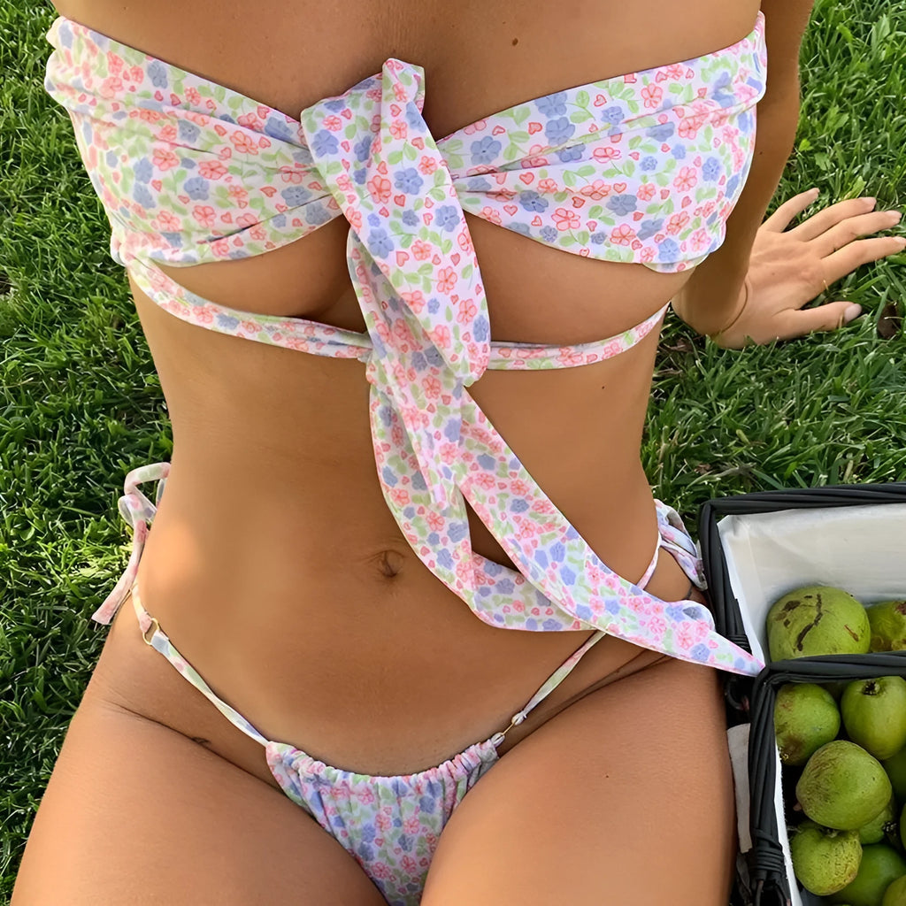 Women's lace-up front swimsuit with split design and floral print