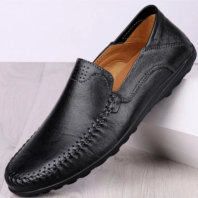 Men's brown leather casual shoes with round toe and flat rubber sole shown from side view