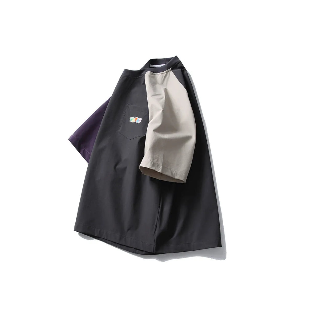 Dark grey loose fit men's T-shirt with contrast colour raglan short sleeves.