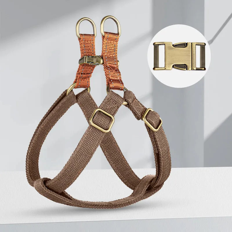 Brown vest style anti loss dog leash made of cotton and nylon with metal clasp.