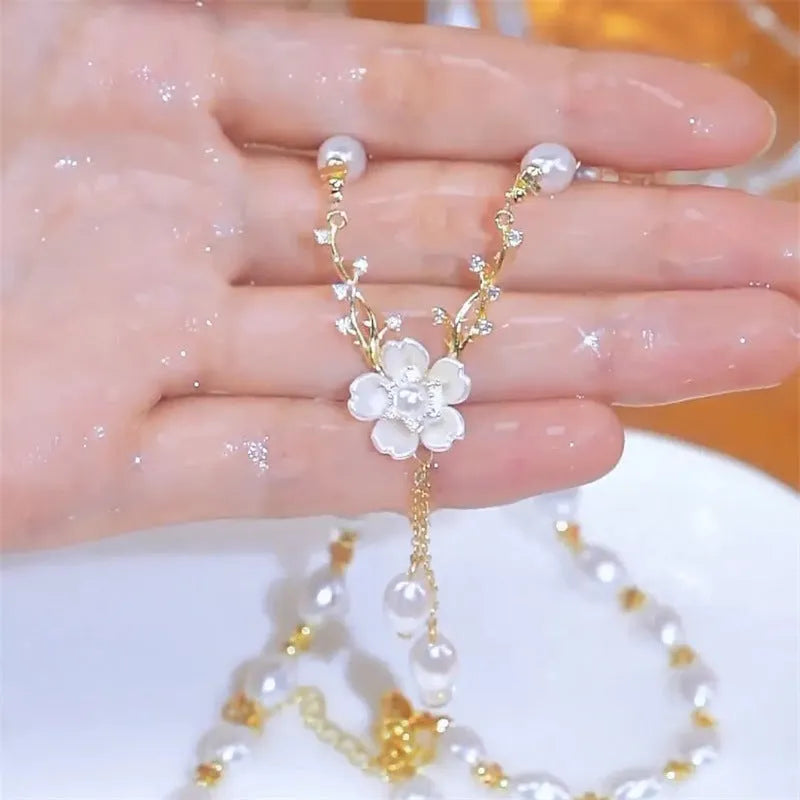 Alloy necklace with pearl chain and floral rose pendant in pearl flower colour.