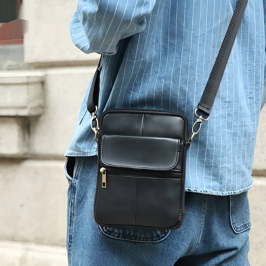 Men's brown genuine leather crossbody shoulder bag with sewn detailing and a shoulder strap.
