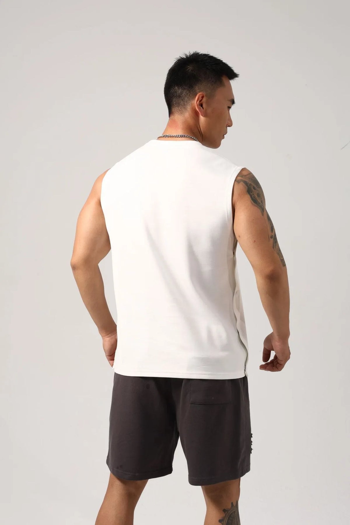 Men's Korean style loose cotton fitness vest with hidden hook side openings in black colour