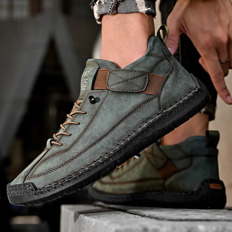 Men's mid-top Martin boot in khaki with sewn sole detail and elastic band.