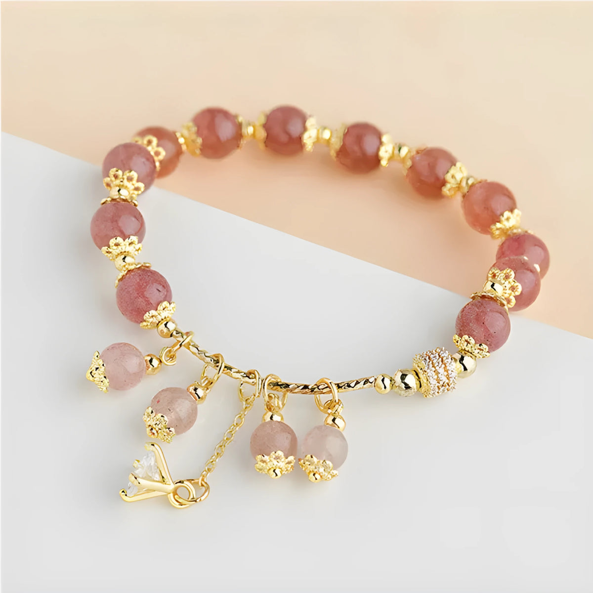 Pink women's crystal bracelet with heart-shaped charms and pearl decorative accents