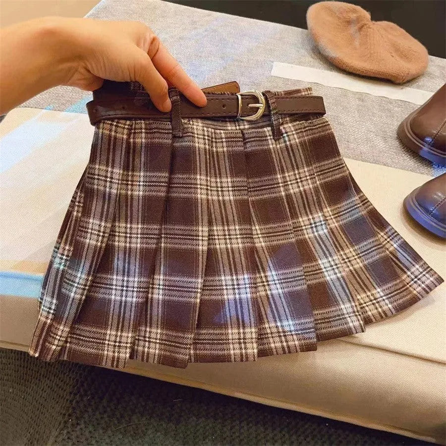 Girls plaid pleated A-line skirt in cotton-blend fabric, shown on a hanger.