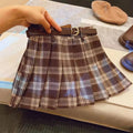 Girls plaid pleated A-line skirt in cotton-blend fabric, shown on a hanger.