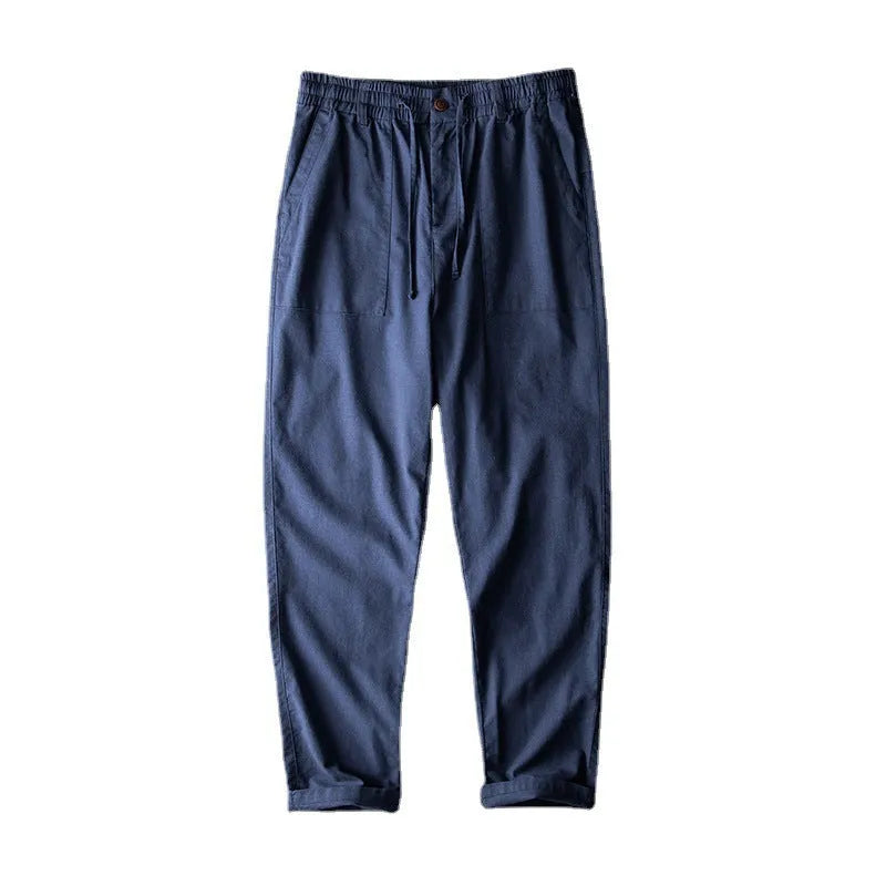 Men's casual linen trousers in retro design showing navy blue, apricot, and grey colour options