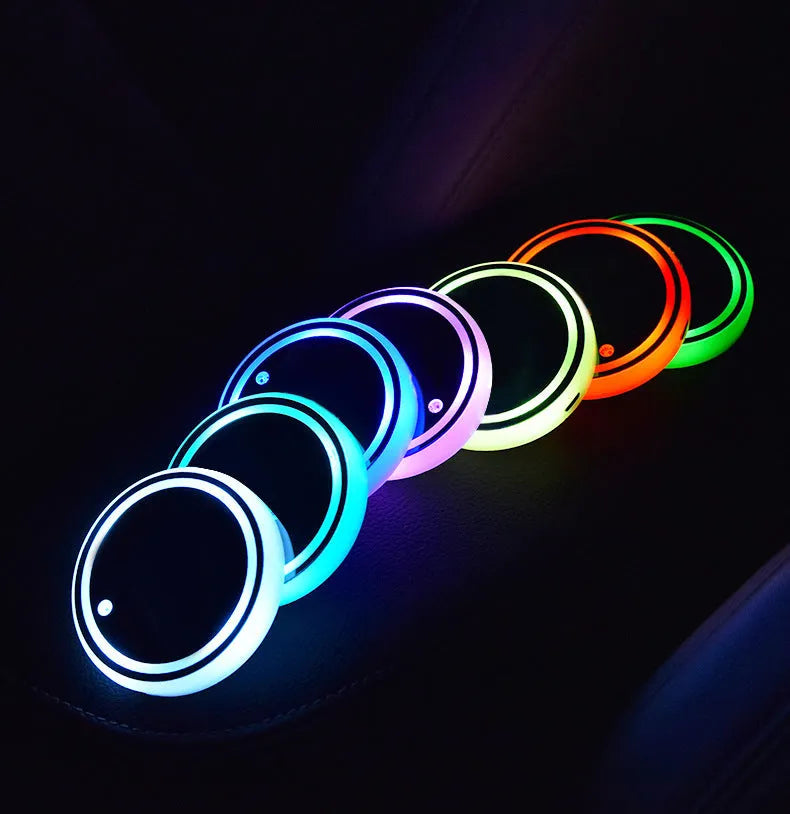 LED light-up cup coaster for cars showing seven colour modes and USB charging cable